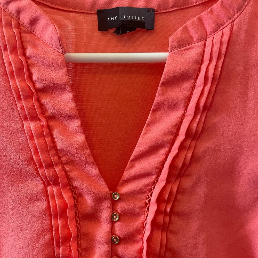 Orange/salmon colored tank. Gold buttons. Size small, Limited